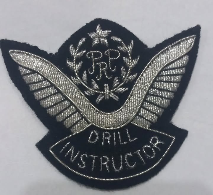 Drill Instructor embroidered badge patch with silver wings and PRP initials on a black fabric background