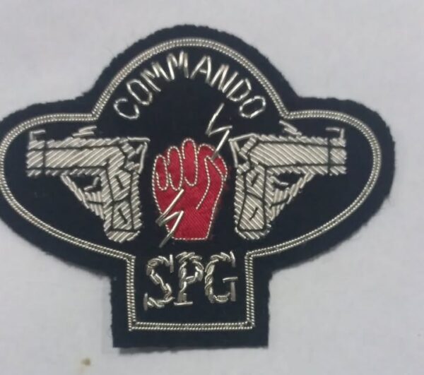 Commando SPG badge with red fist and dual pistols embroidered patch