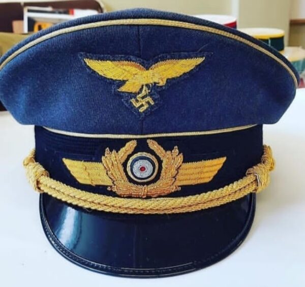 WWII German Luftwaffe officer visor cap with gold embroidery, eagle insignia, and swastika.